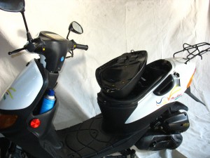 Moped with broken plastic hinge Moped with broken plastic hinge